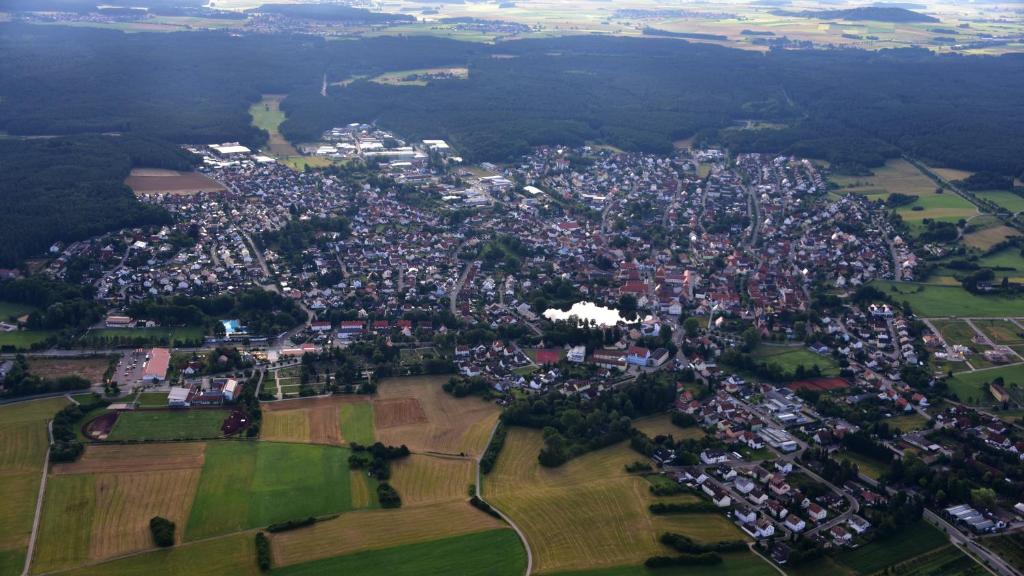 an aerial view of a city with houses and trees at Ferienwohnung Sonnenschein in Allersberg in Allersberg