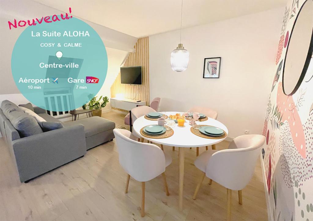 ein Wohnzimmer mit einem weißen Tisch und Stühlen in der Unterkunft La Suite ALOHA, Elegant & Cosy in Beauvais