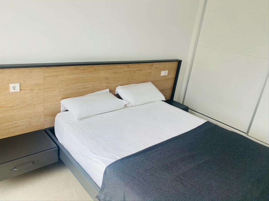 Ένα ή περισσότερα κρεβάτια σε δωμάτιο στο vistabella golf maui