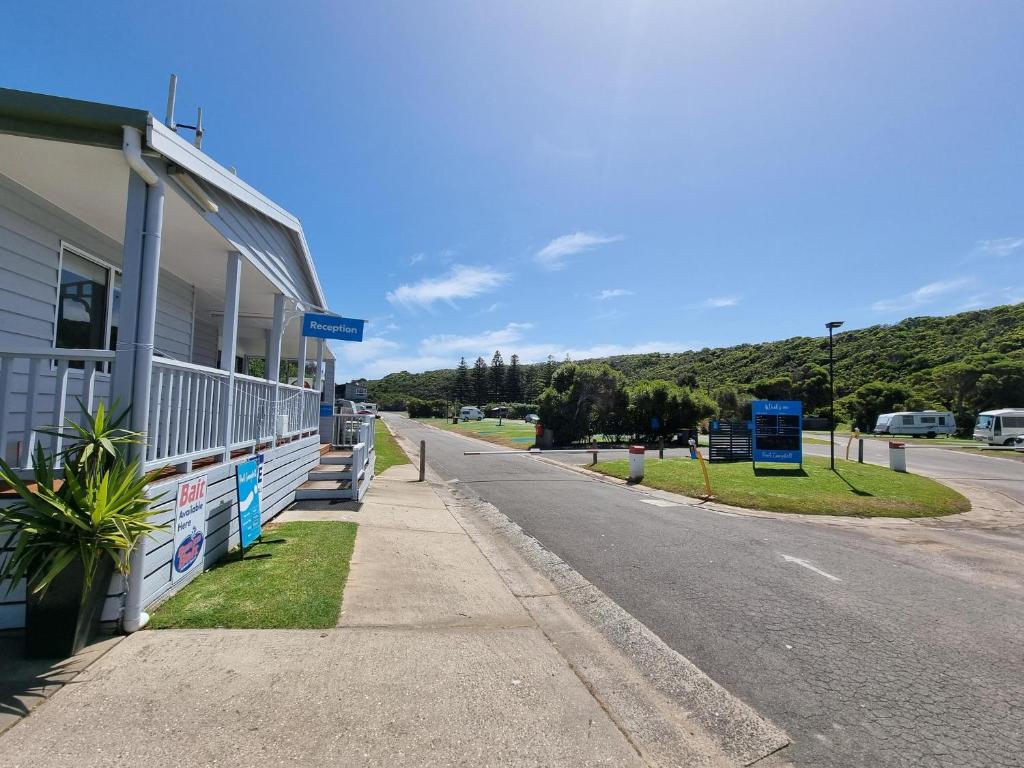 an empty street in front of a building at NRMA Port Campbell Holiday Park in Port Campbell