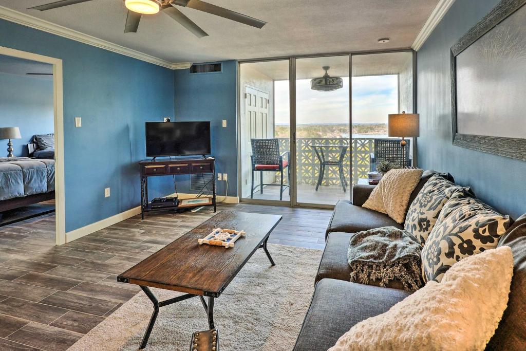 a living room with a couch and a table at Quaint Condo with Views and Pool Access! in Hot Springs