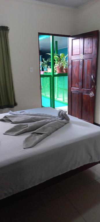 Postel nebo postele na pokoji v ubytování Hotel Trianon