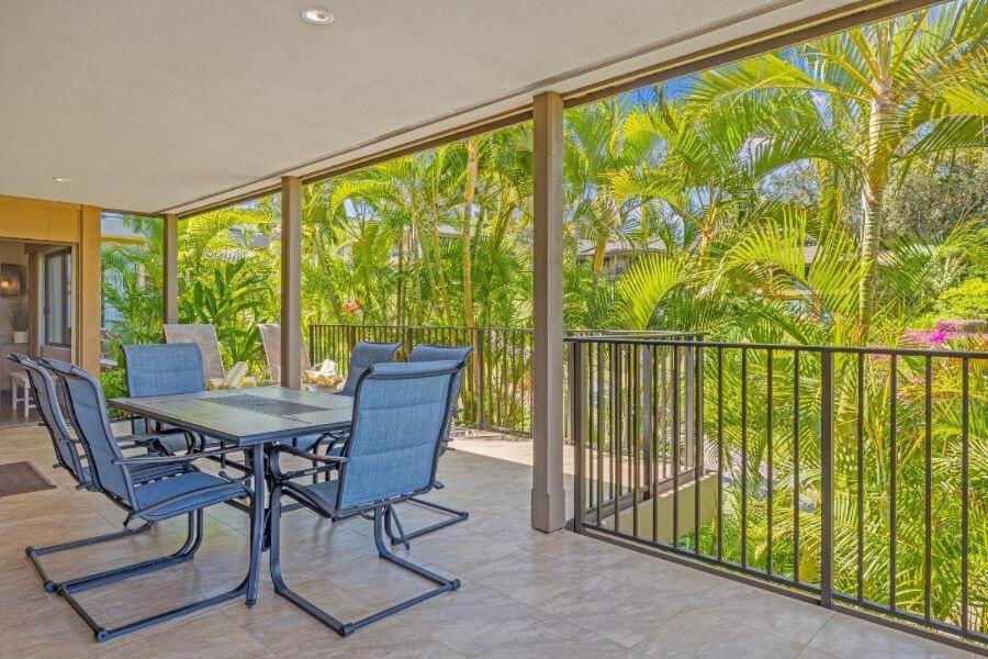 a patio with a table and chairs on a balcony at WAILEA ELUA, #1509 condo in Wailea