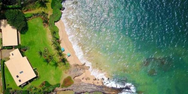 an aerial view of a beach and the ocean at My Waii Beach Cottage home in Kihei