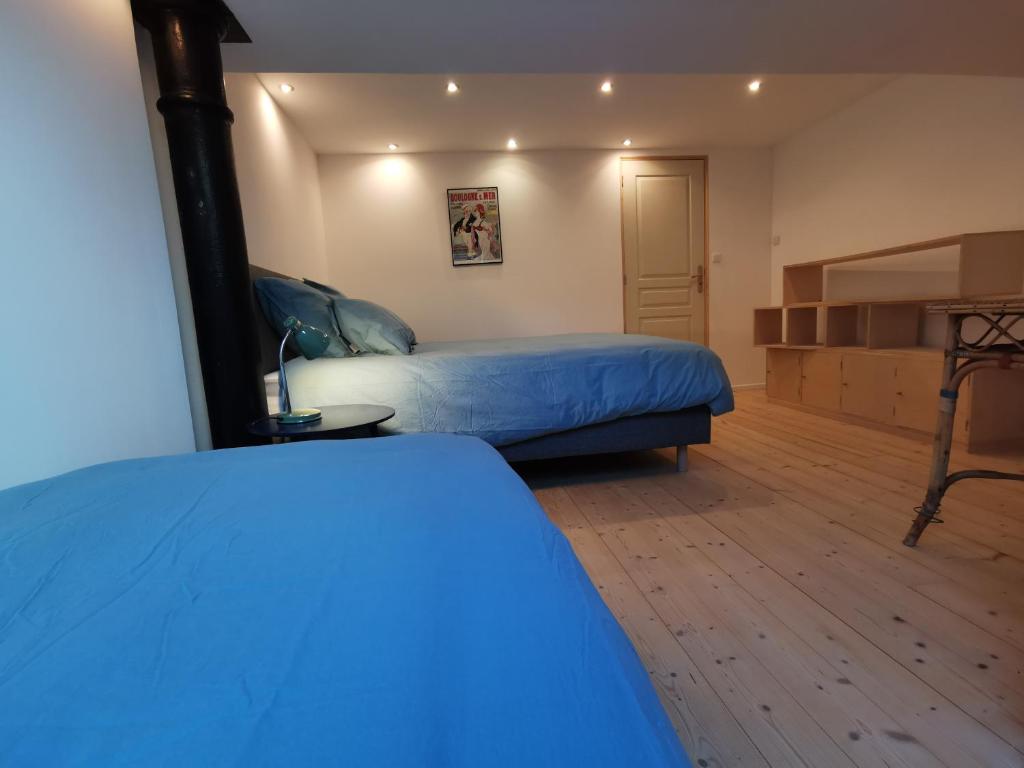 Posteľ alebo postele v izbe v ubytovaní Ancien magasin type loft 145 m2 centre ville