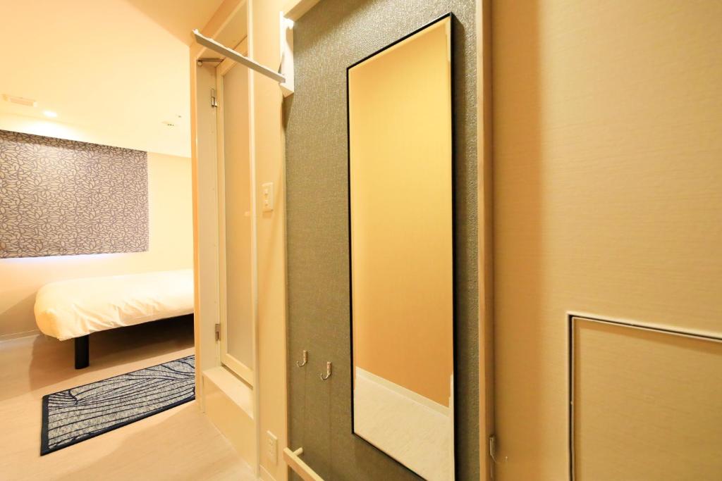 Postel nebo postele na pokoji v ubytování Hotel Nihonbashi Saibo