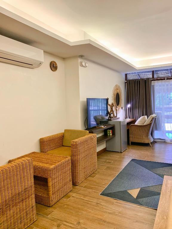 TV a/nebo společenská místnost v ubytování Banig Beach Resort El Nido