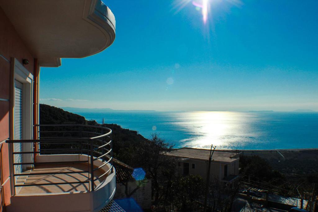 a view of the ocean from a balcony of a house at Apartments Vila Emiliano in Borsh