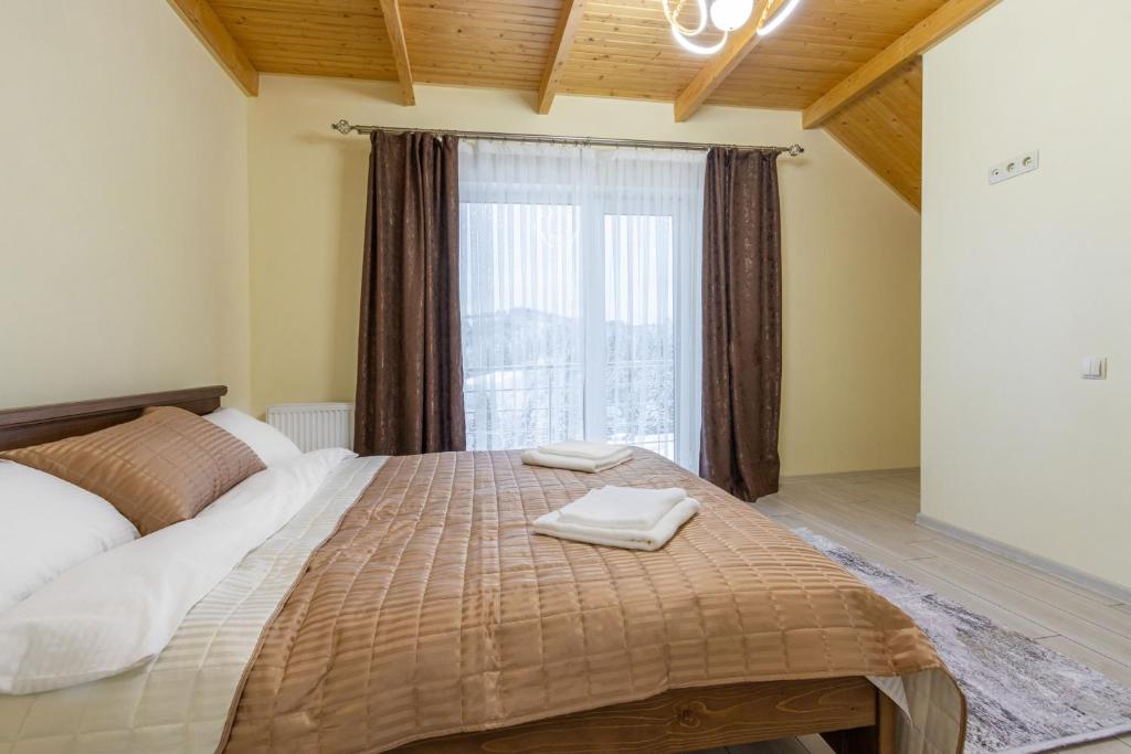 Postel nebo postele na pokoji v ubytování Шепіт Лісу