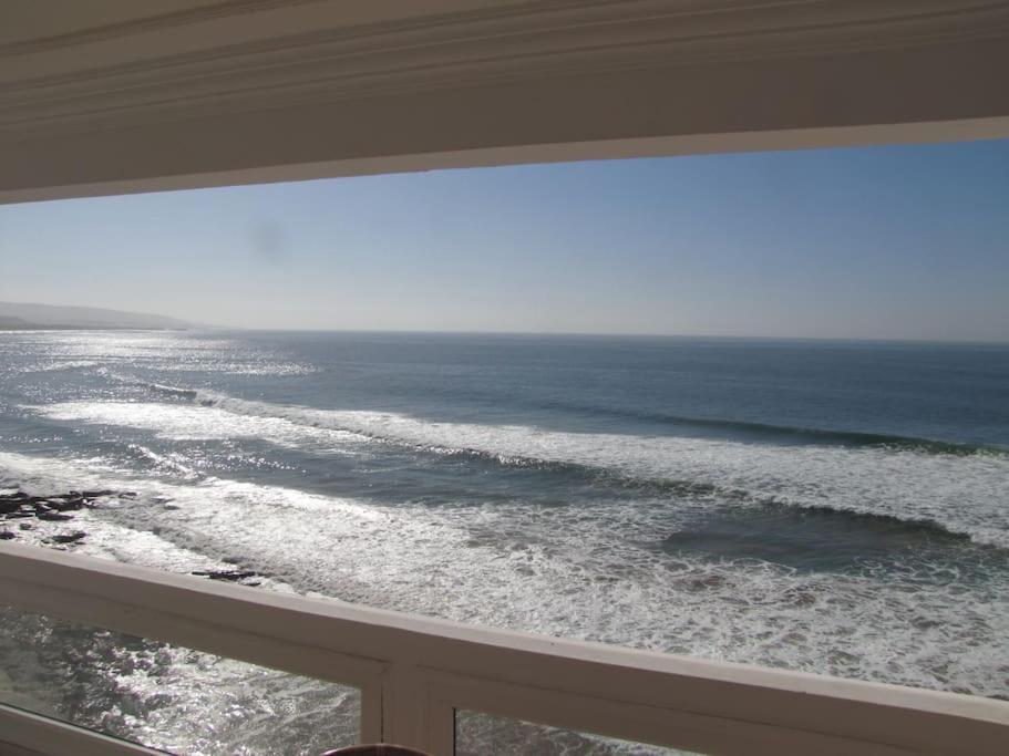 a view of the ocean from a balcony at Taghazout Waves 1 in Taghazout