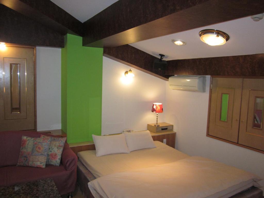 Postel nebo postele na pokoji v ubytování Hotel Essor (Adult Only)
