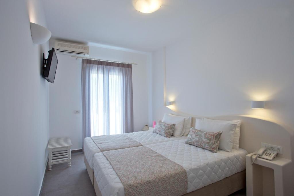 Postel nebo postele na pokoji v ubytování Alexandra Hotel