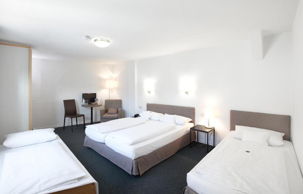Postel nebo postele na pokoji v ubytování Hotel Klingelhöffer
