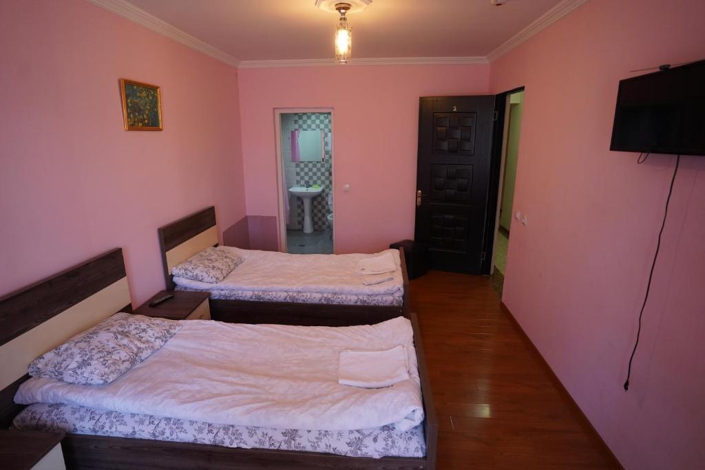 Postel nebo postele na pokoji v ubytování imperator 1 Hotel