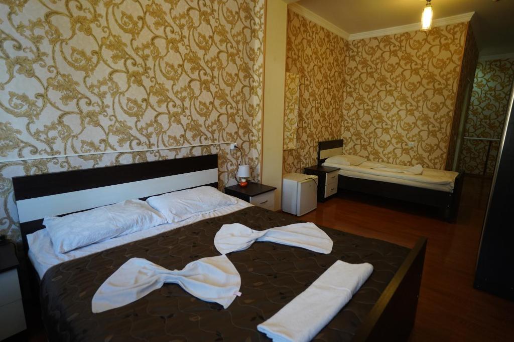Postel nebo postele na pokoji v ubytování imperator 1 Hotel