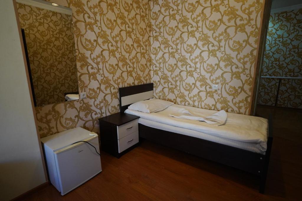 Postel nebo postele na pokoji v ubytování imperator 1 Hotel