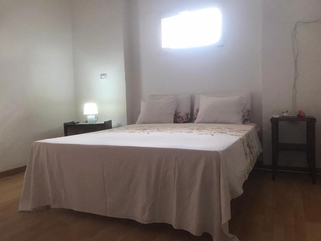 Postel nebo postele na pokoji v ubytování Tenuta Palladini 5 chilometri da porto cesario