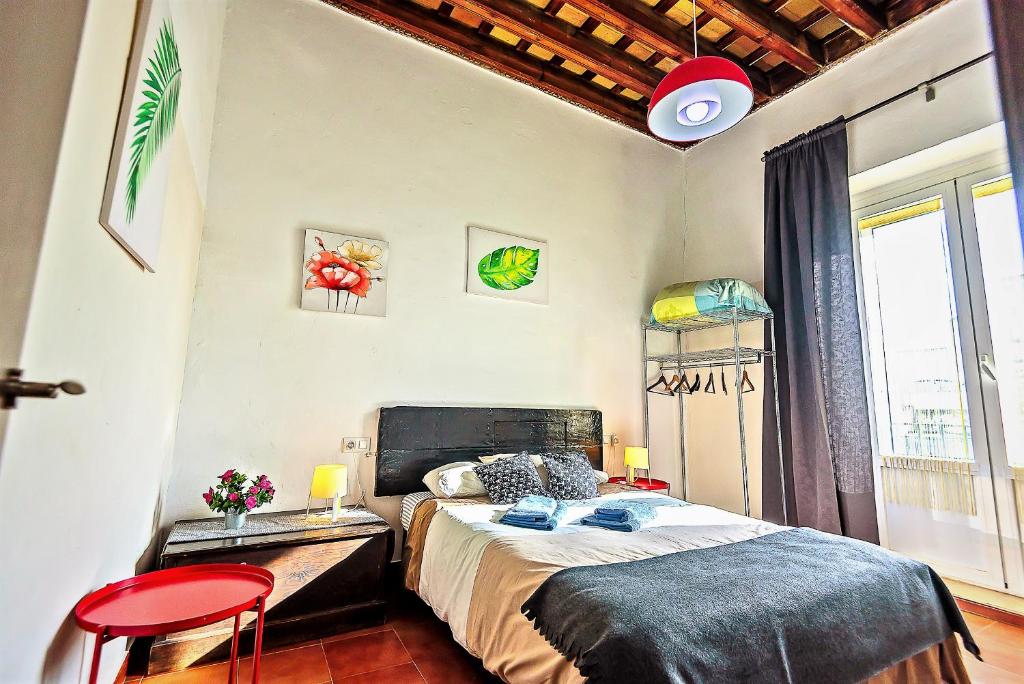 A bed or beds in a room at Milagros Central Apartments