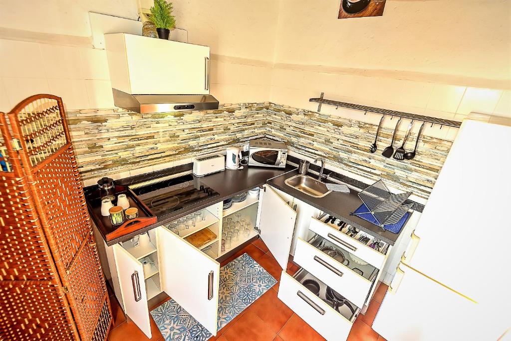 A kitchen or kitchenette at Milagros Central Apartments