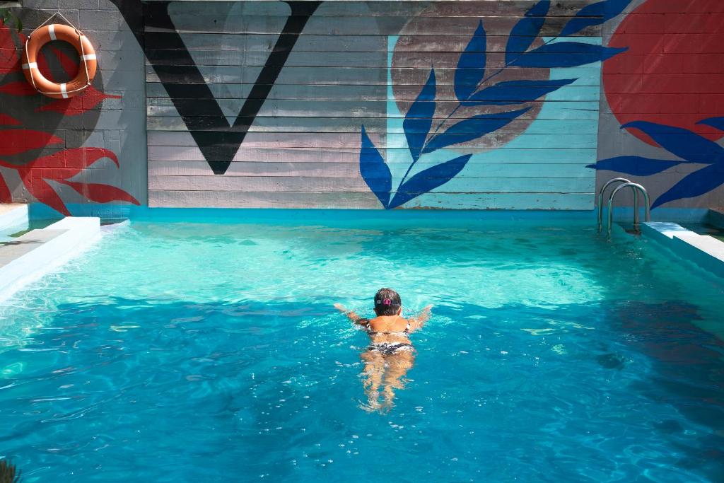 a woman swimming in a swimming pool in a swimming pool at Camping Alta Ribagorça in El Pont de Suert