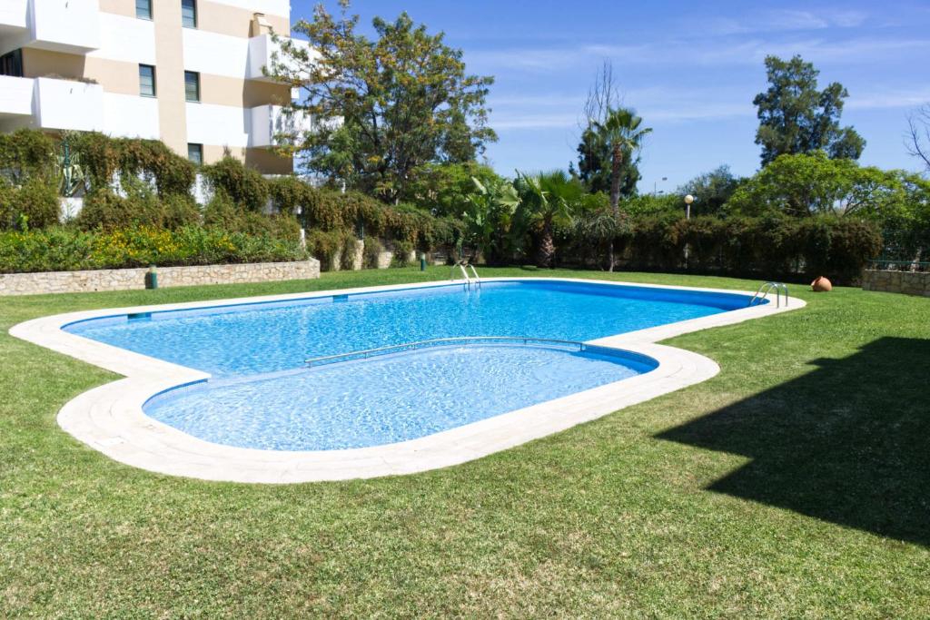 Het zwembad bij of vlak bij Beach & Golf Cabanas Apartment