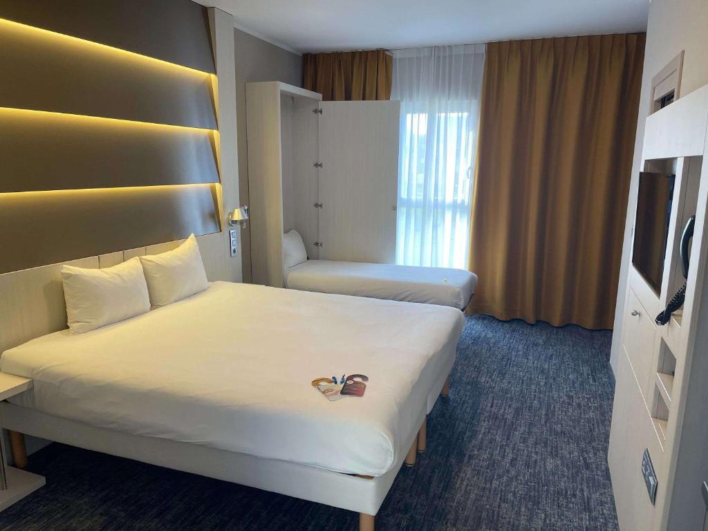 Postel nebo postele na pokoji v ubytování Ibis Styles Nivelles