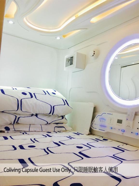 A bed or beds in a room at Harbour Hella Inn