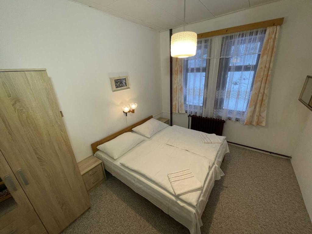 Postel nebo postele na pokoji v ubytování Hotel Zlatá vyhlídka