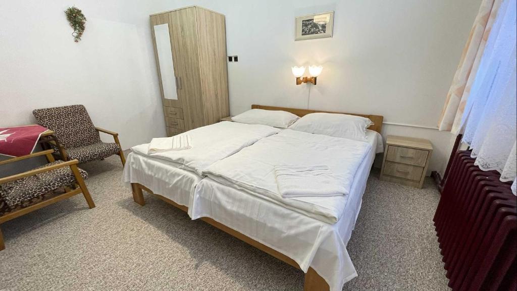 Postel nebo postele na pokoji v ubytování Hotel Zlatá vyhlídka