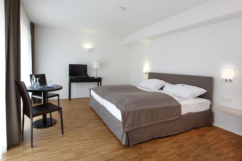 Postel nebo postele na pokoji v ubytování Hotel Klingelhöffer