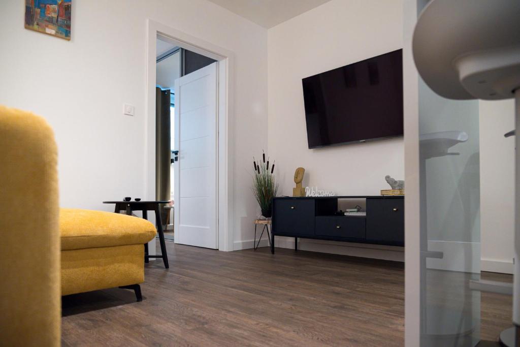TV a/nebo společenská místnost v ubytování MINMAR Apartments
