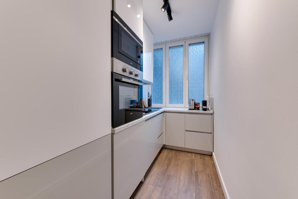 Kuchyň nebo kuchyňský kout v ubytování MINMAR Apartments