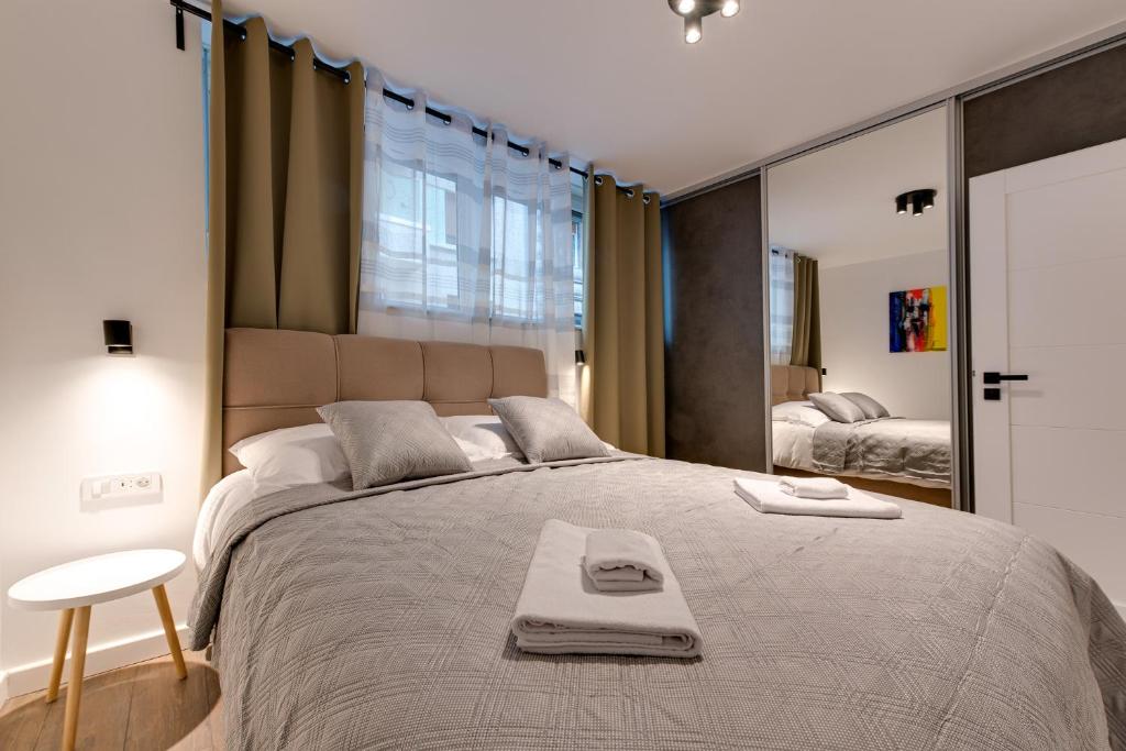 Postel nebo postele na pokoji v ubytování MINMAR Apartments
