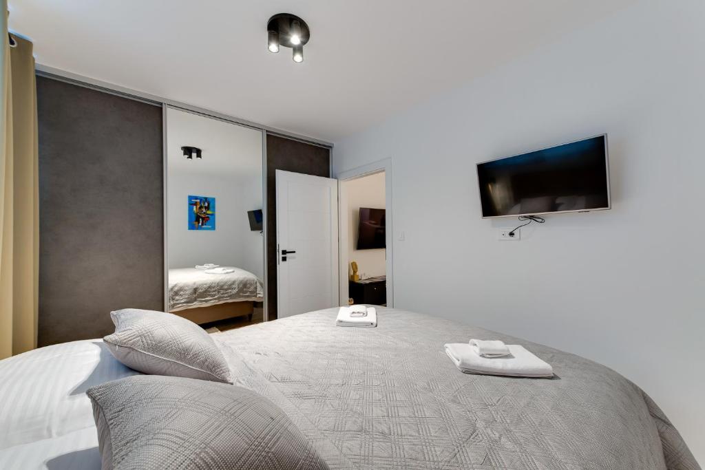Postel nebo postele na pokoji v ubytování MINMAR Apartments