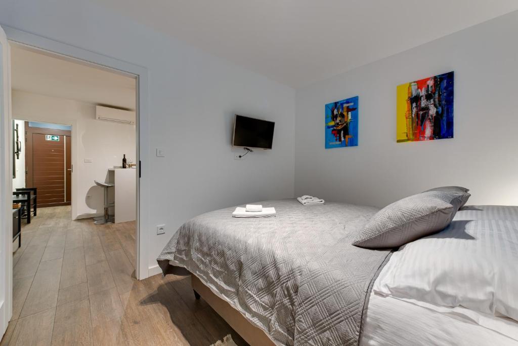 Postel nebo postele na pokoji v ubytování MINMAR Apartments