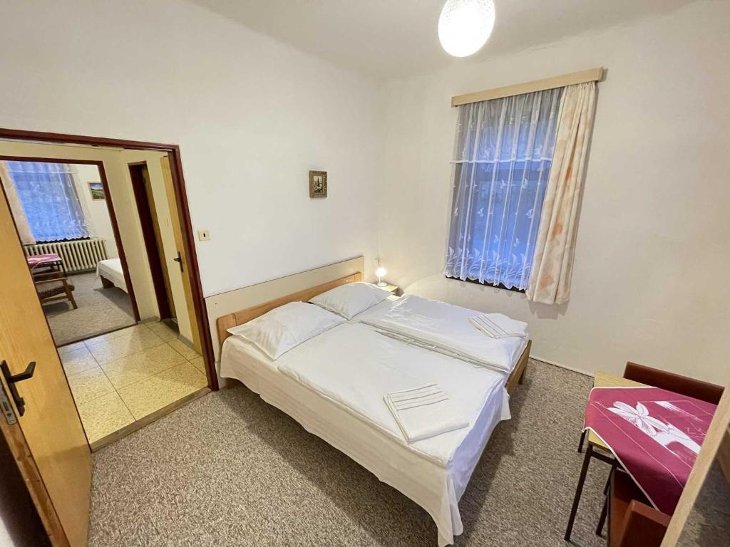 Postel nebo postele na pokoji v ubytování Hotel Zlatá vyhlídka