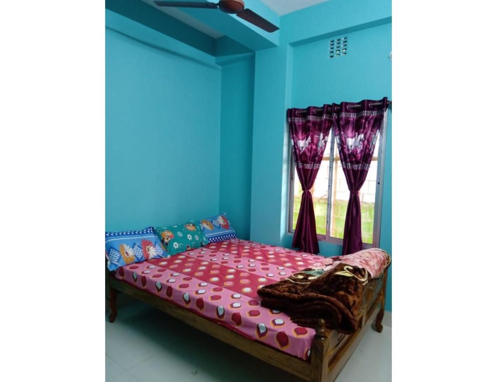 Voodi või voodid majutusasutuse Sagar Lodge, Bishnupur, WB toas