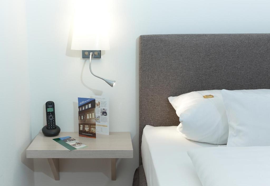 Postel nebo postele na pokoji v ubytování Hotel Klingelhöffer