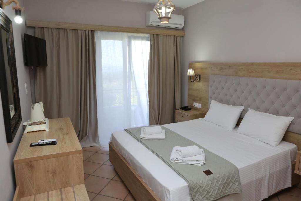 Postel nebo postele na pokoji v ubytování Caretta - Caretta Hotel