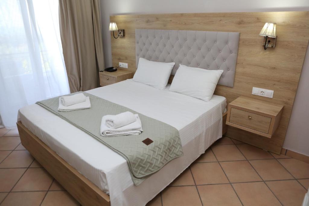 Postel nebo postele na pokoji v ubytování Caretta - Caretta Hotel