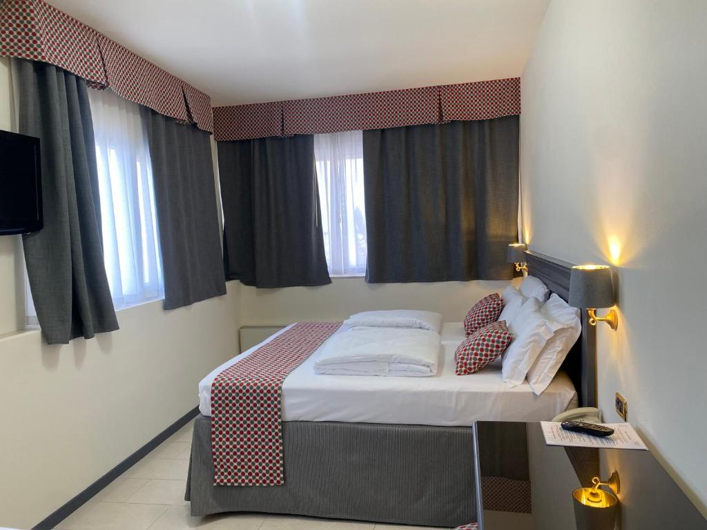 Postel nebo postele na pokoji v ubytování Hotel Estée