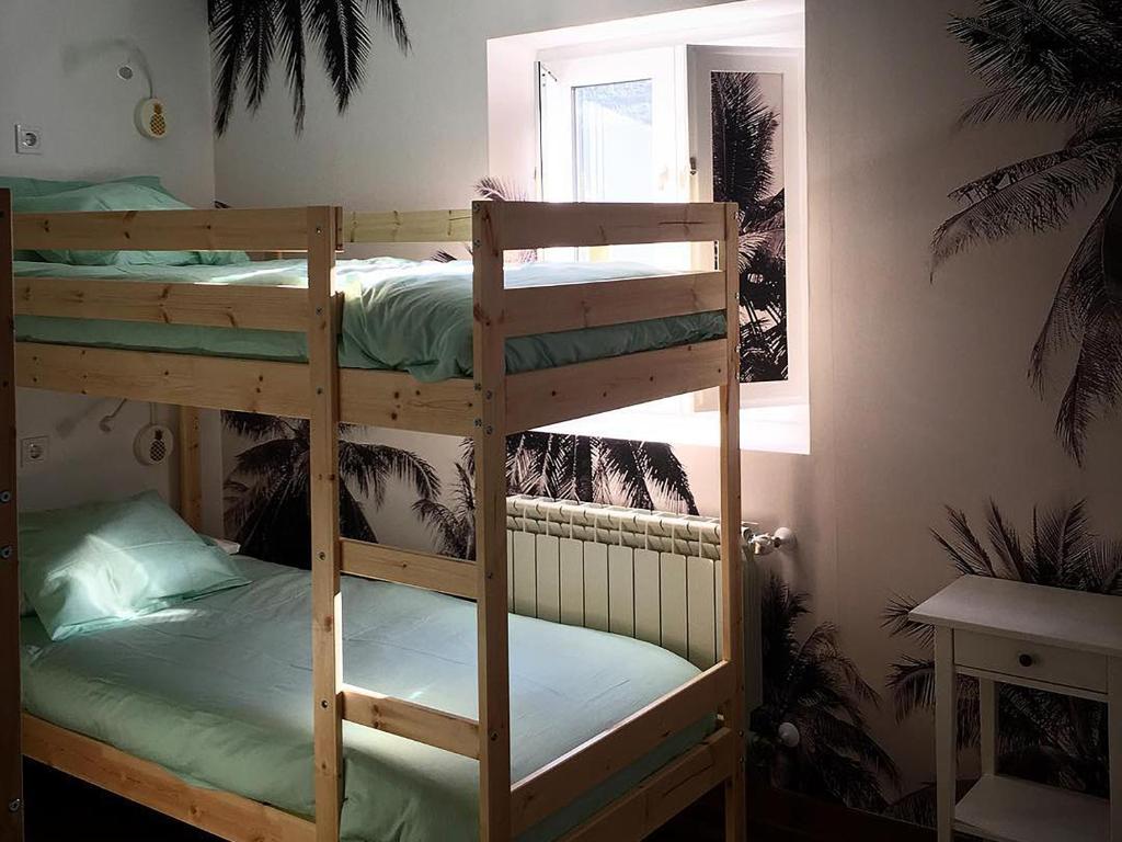 Postel nebo postele na pokoji v ubytování COCOS SURFHOUSE