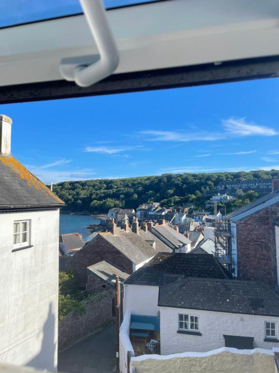 a view of a town with houses and a river at Seapink, Kingsand; luxury Cornish cottage with seaviews, bbq & paddleboards in Kingsand