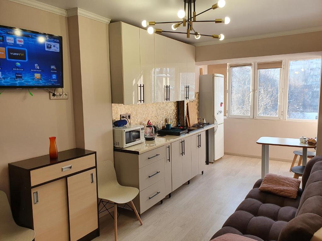 Køkken eller tekøkken på Апартаменты