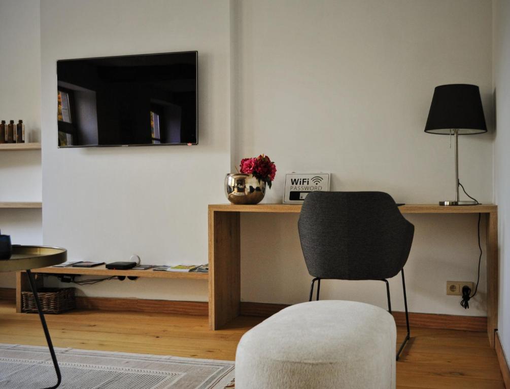 TV a/nebo společenská místnost v ubytování Gîte de charme bord de Meuse