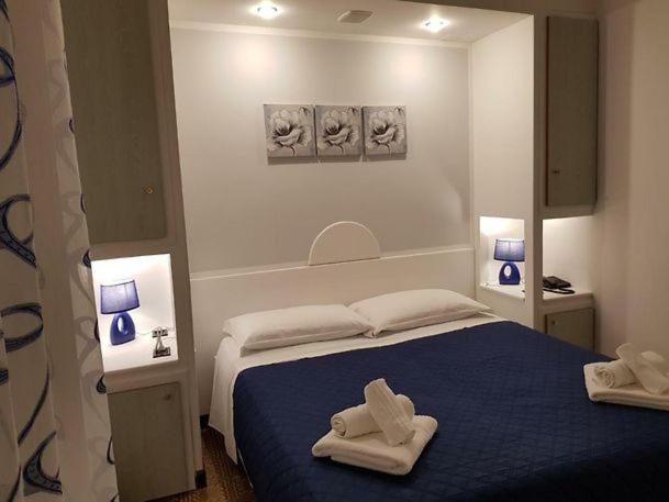 Postel nebo postele na pokoji v ubytování Hotel La Plancia