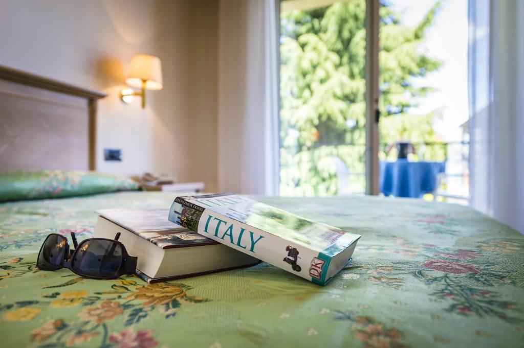 Cama o camas de una habitación en Hotel Lido La Perla Nera