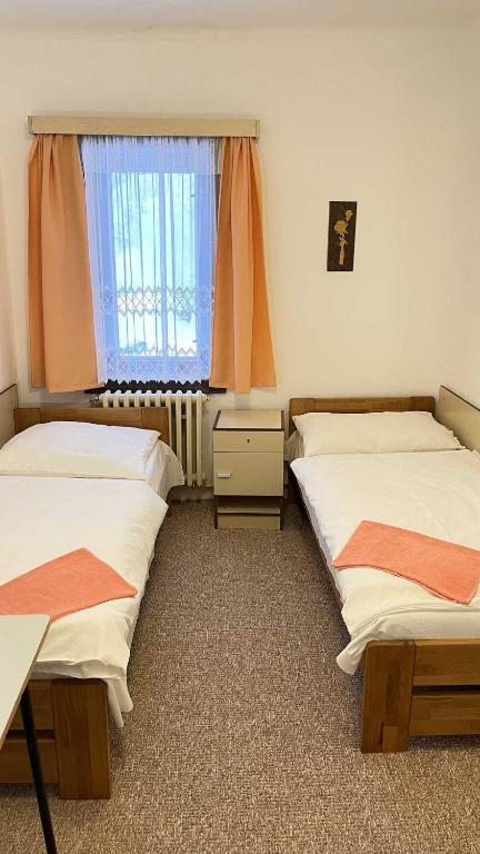 Postel nebo postele na pokoji v ubytování Hotel Zlatá vyhlídka
