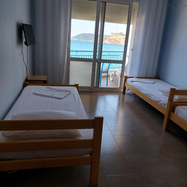 Postel nebo postele na pokoji v ubytování Apartmani Orange Dreams