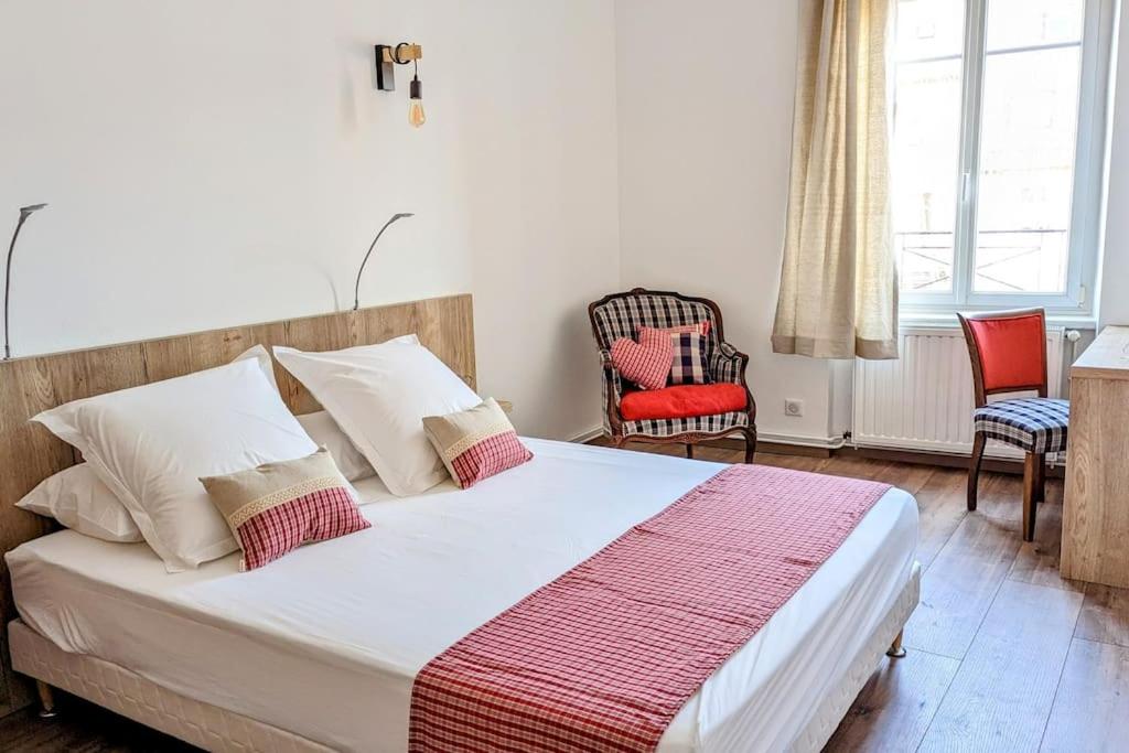 Ένα ή περισσότερα κρεβάτια σε δωμάτιο στο Appartement Chez Mar'Tine